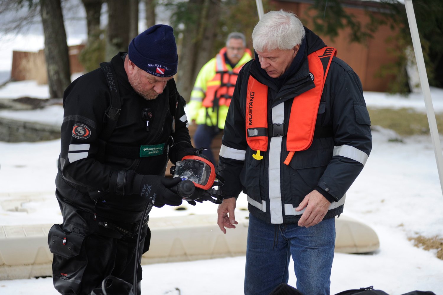 Sullivan County Dive & Rescue Team captain Joe Ratner, left, and co-captain Warren Wagner are pictured making adjustments to a diving mask assembly.